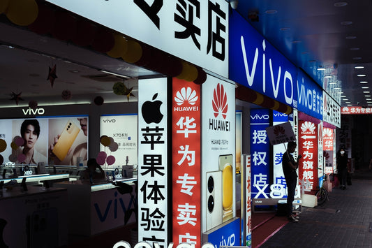 a store front with a variety of advertisements on it