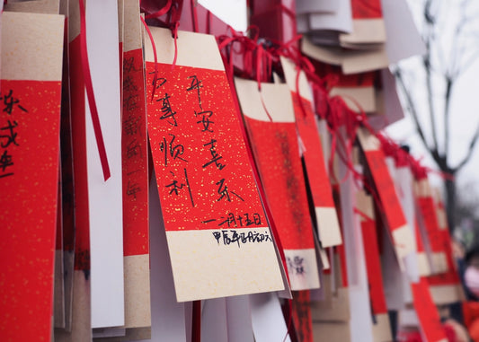 A bunch of red and white cards with writing on them